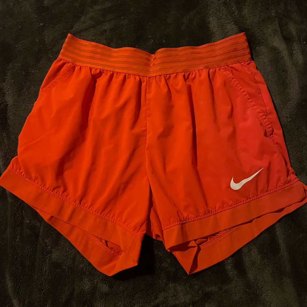 Bright orange Nike shorts